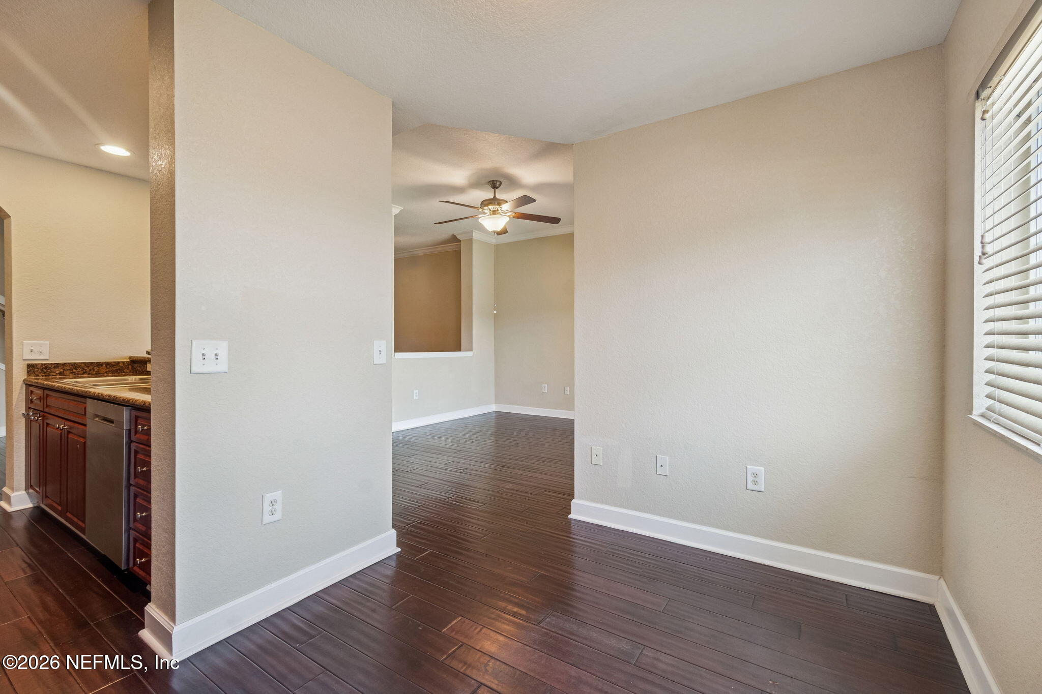 9745 Touchton Road, Unit 2903 Jacksonville, FL 32246 - Photo 34 of 155 an empty room with wooden floor cabinet and windows