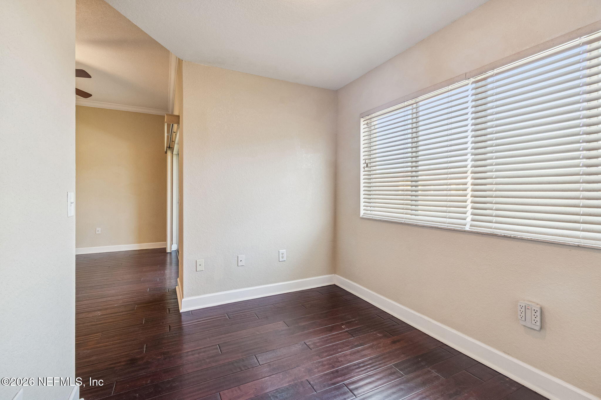 9745 Touchton Road, Unit 2903 Jacksonville, FL 32246 - Photo 35 of 155 an empty room with wooden floor and a window