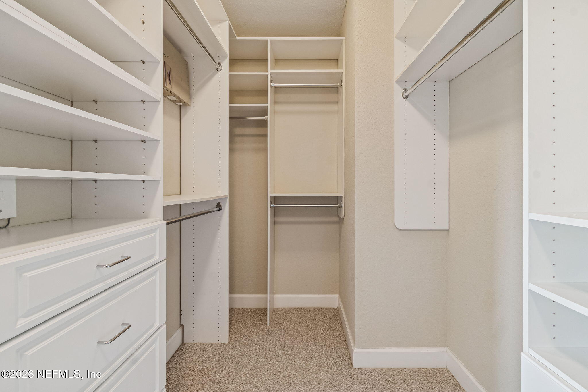 9745 Touchton Road, Unit 2903 Jacksonville, FL 32246 - Photo 50 of 155 a view of walk in closet with empty racks