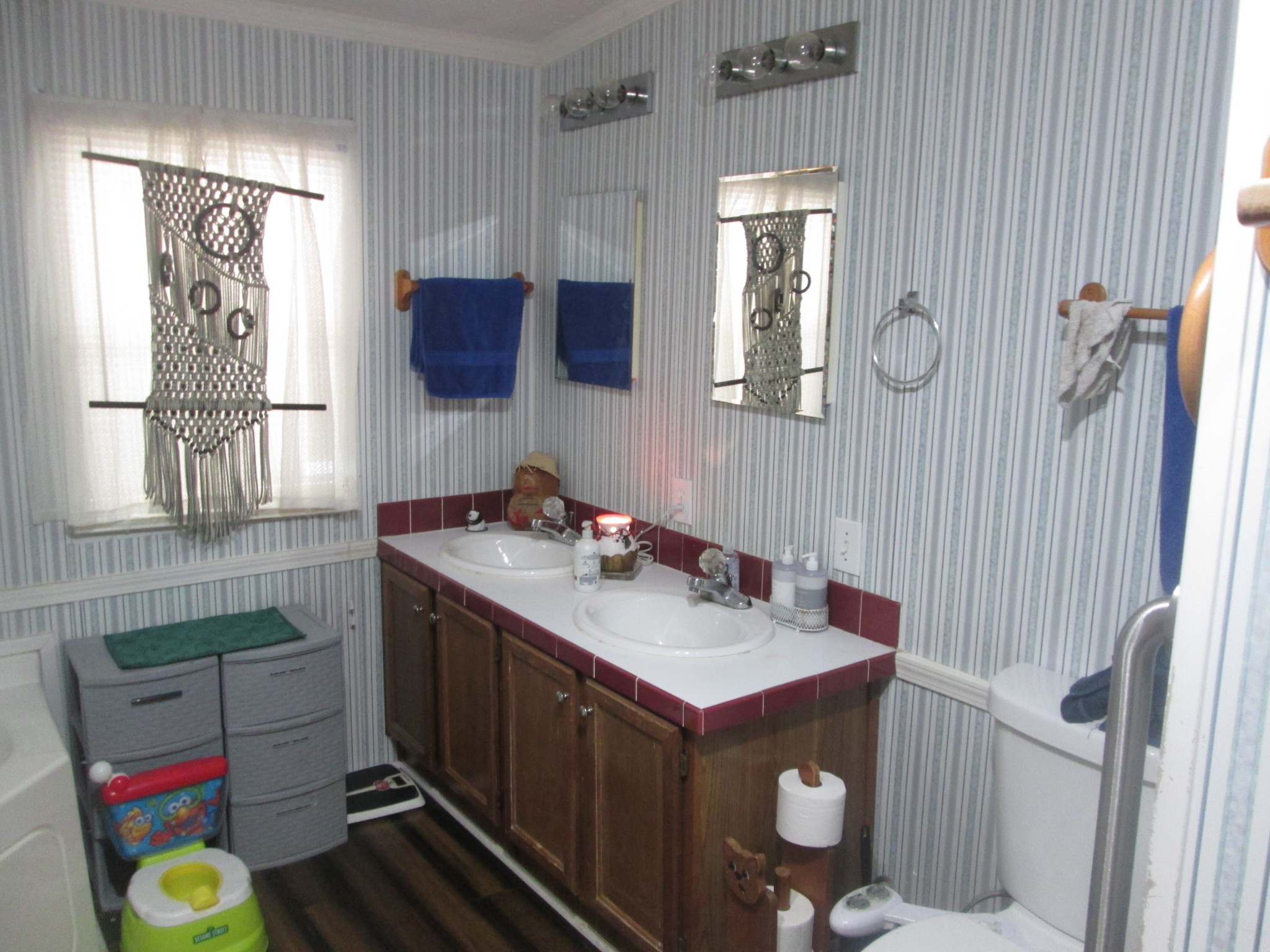 321 Manzano Road Madison, TN 37115 - Photo 13 of 16 a bathroom with a sink mirror vanity and toilet
