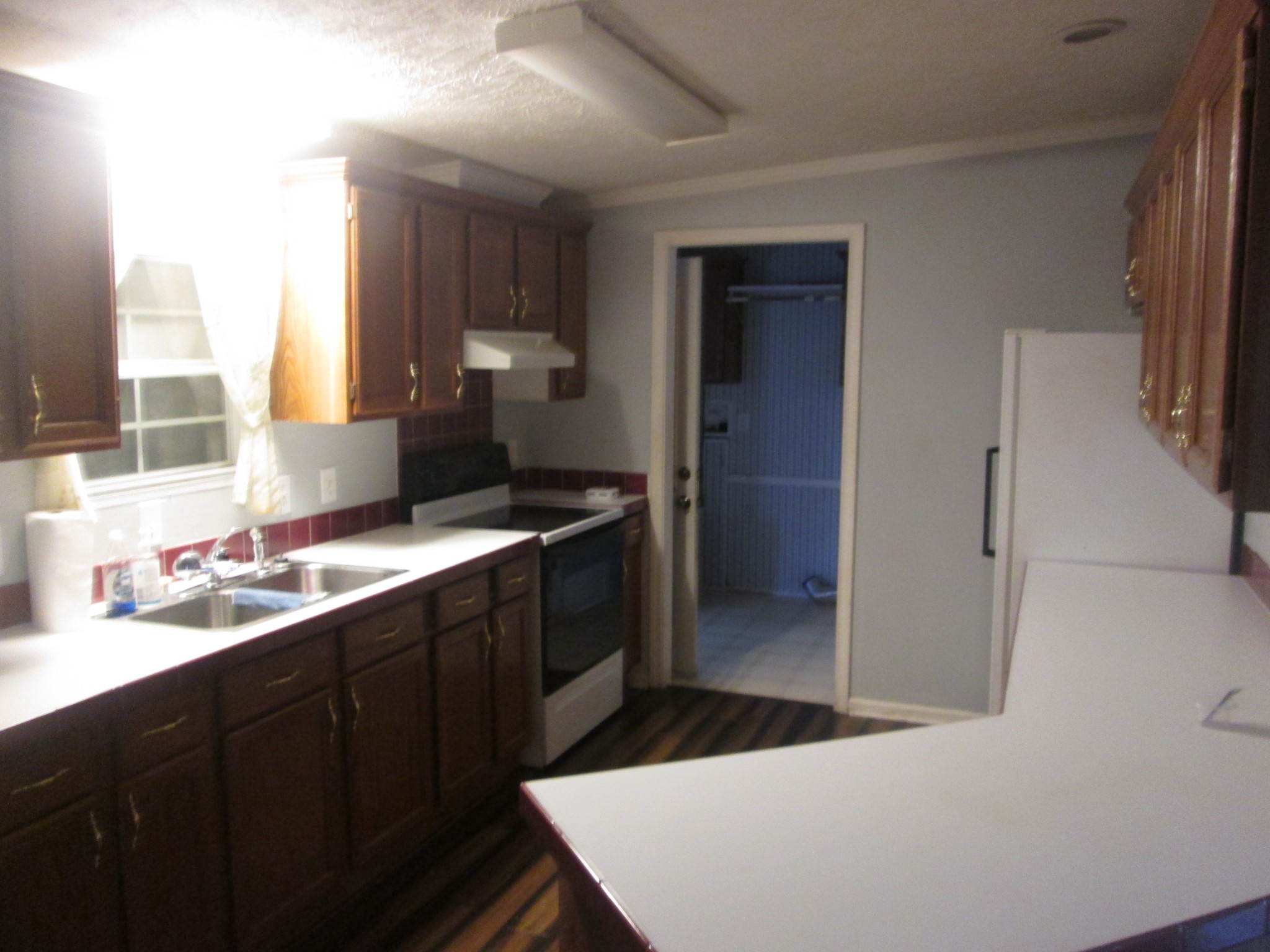 321 Manzano Road Madison, TN 37115 - Photo 5 of 16 a kitchen with a sink and a refrigerator