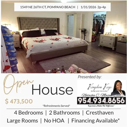 a bedroom with a bed and a mirror