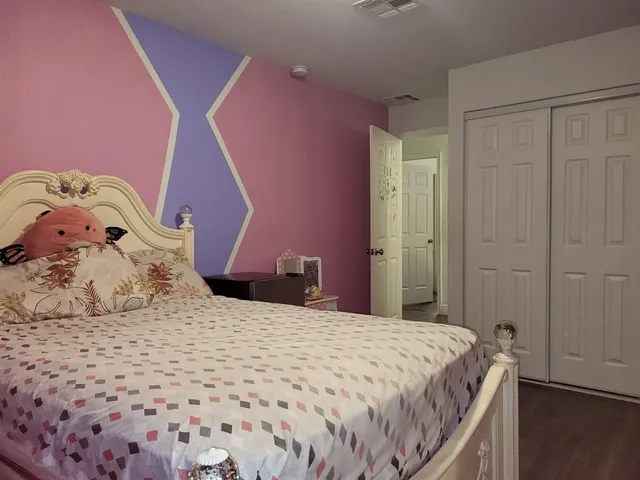 a room with furniture and a flat screen tv