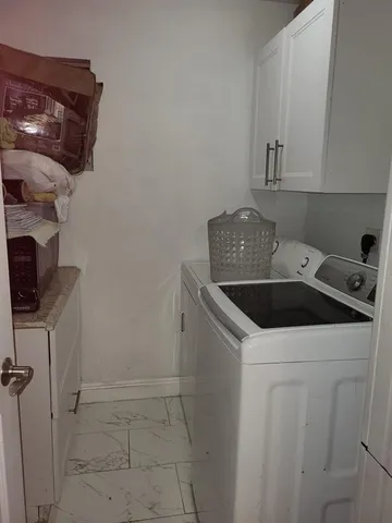 a view of a backyard with a tree