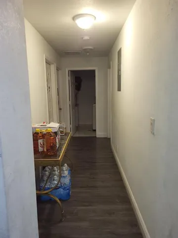 a bedroom with a bed and dresser