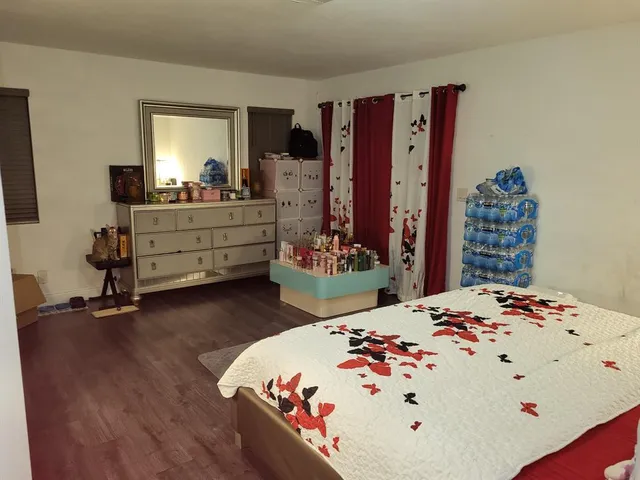 a view of walk in closet with clothes