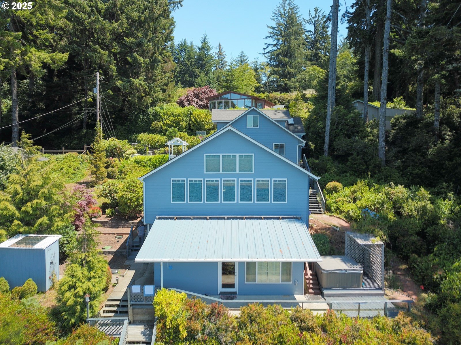 84284 Alder Drive Florence, OR 97439 - Photo 11 of 43 a view of house with yard outdoor seating and entertaining space