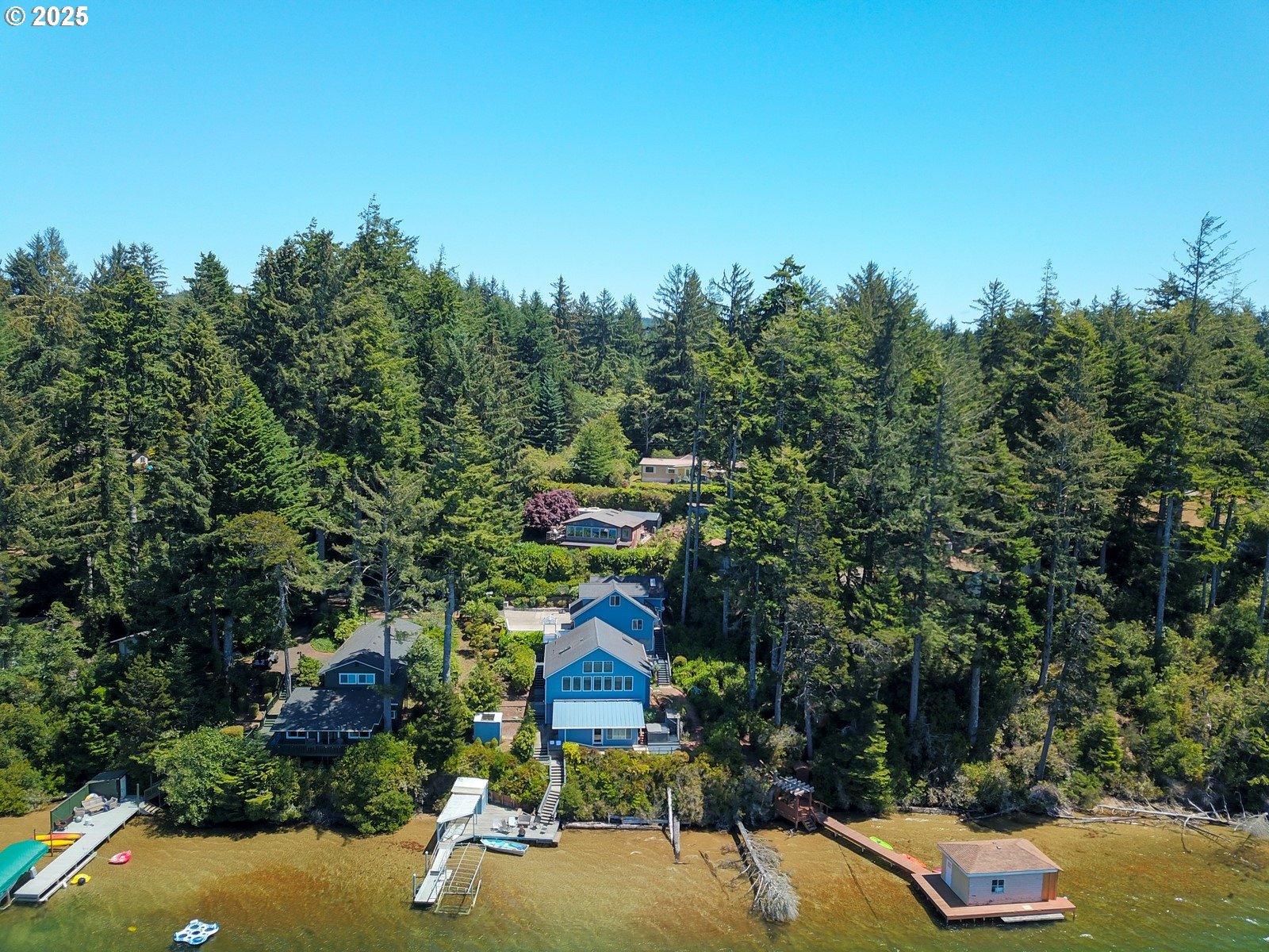 84284 Alder Drive Florence, OR 97439 - Photo 13 of 43 a swimming pool with some trees in the background
