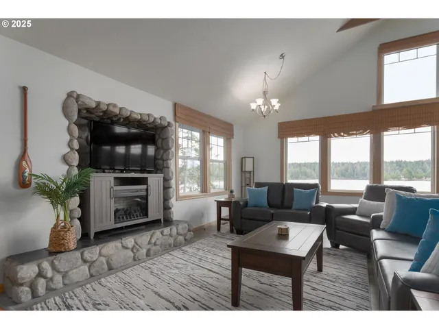 a kitchen with stainless steel appliances granite countertop a refrigerator and wooden cabinets