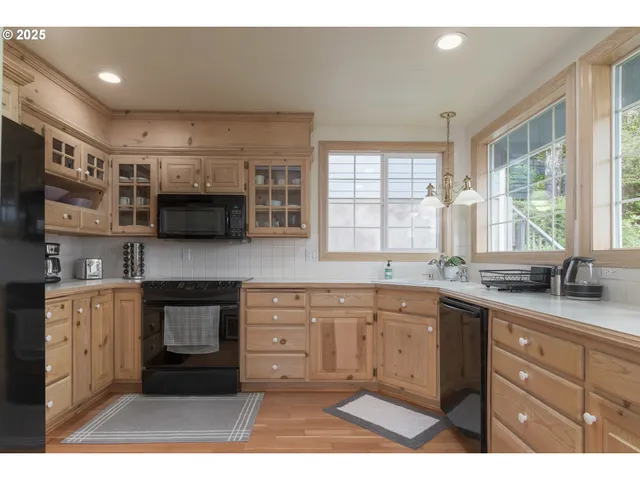a kitchen with a sink and large window