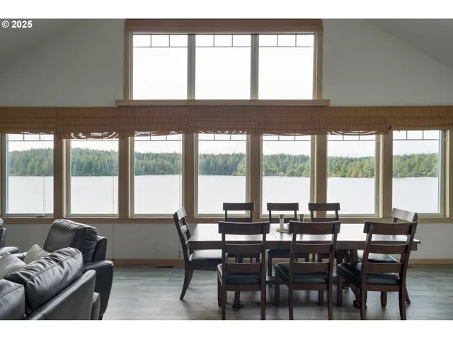 a view of a dining room with furniture and window