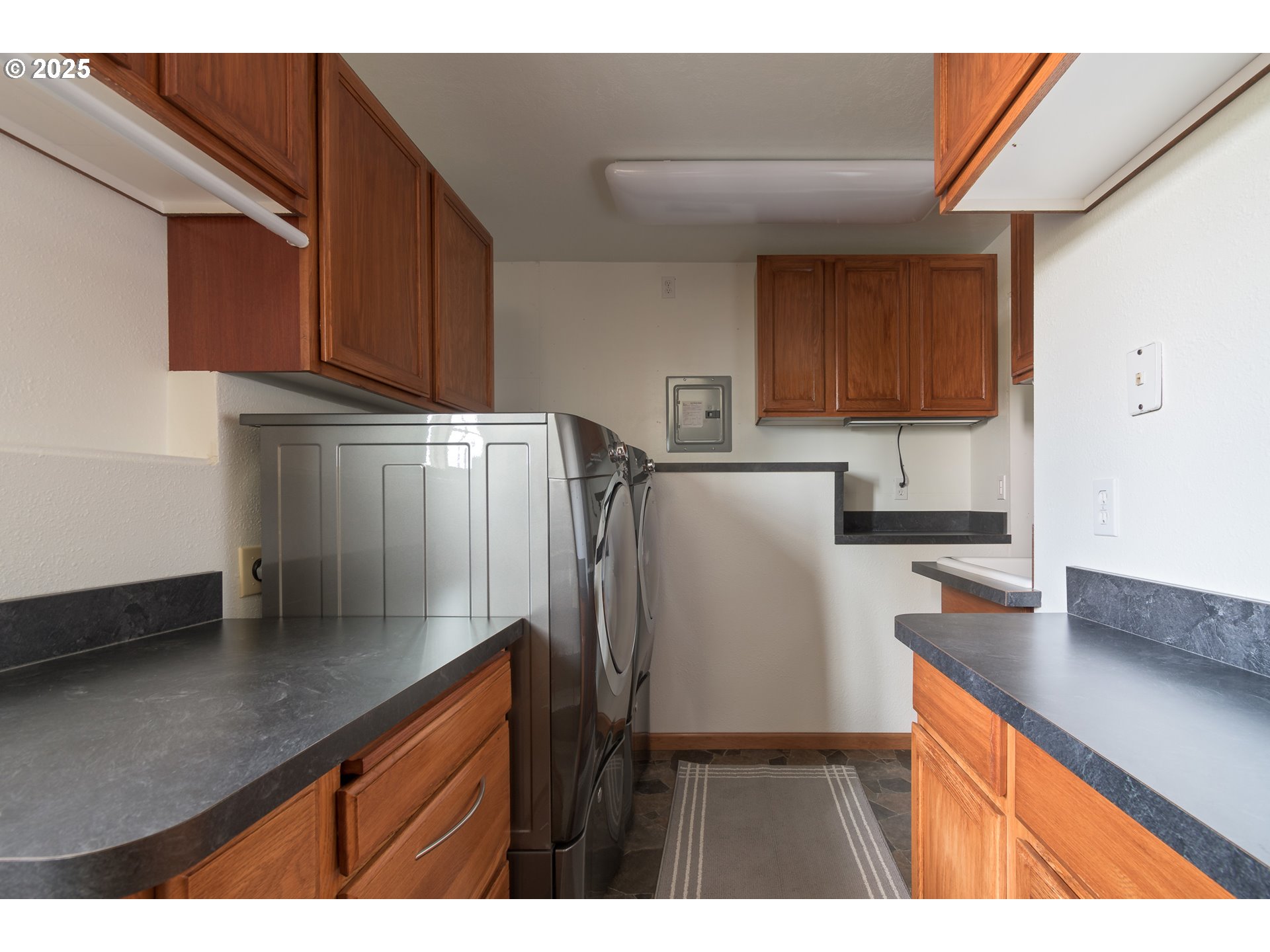 84284 Alder Drive Florence, OR 97439 - Photo 37 of 43 a kitchen with refrigerator and cabinets
