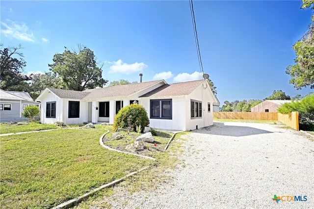 a view of a house with a snow in the yard