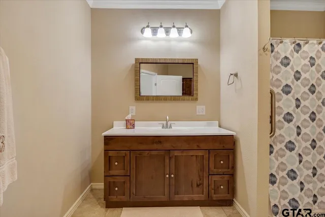 a bathroom with a toilet a sink and a mirror