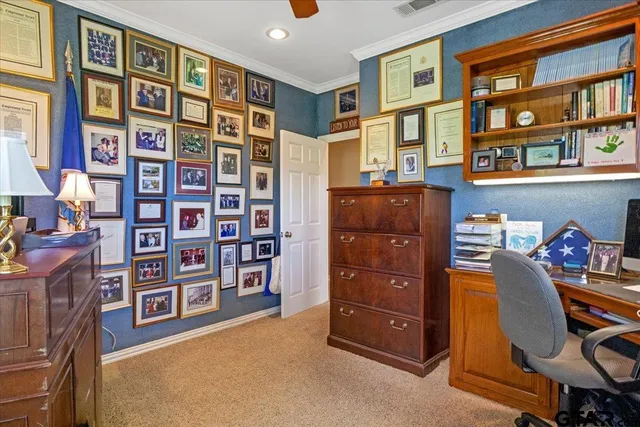 a bed sitting in a room next to a window