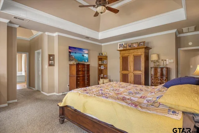 a bedroom with a bed and a table in it