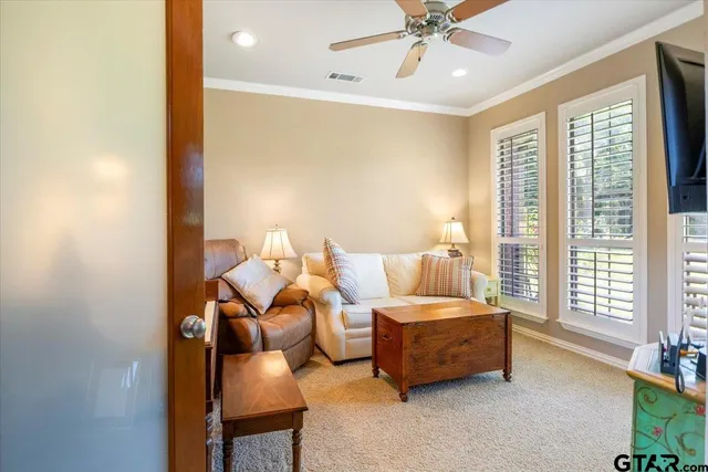 a spacious bedroom with a bed and a couch