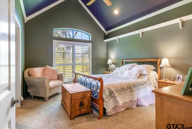 a bedroom with a bed and window