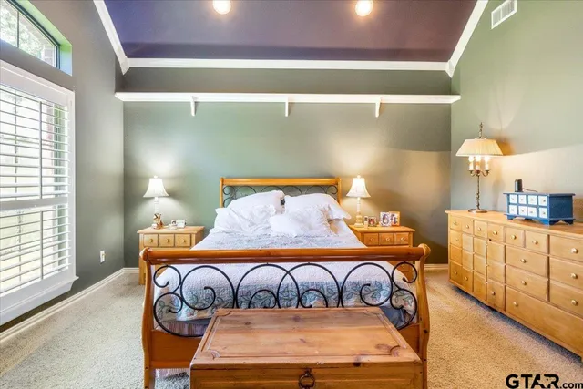 a bedroom with furniture and a window