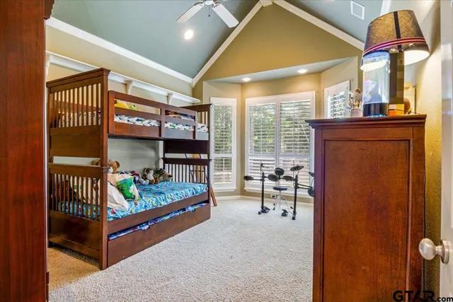 a bedroom with furniture and a window