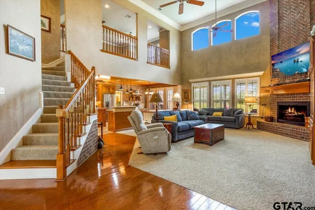 a living room with fireplace furniture and a fireplace