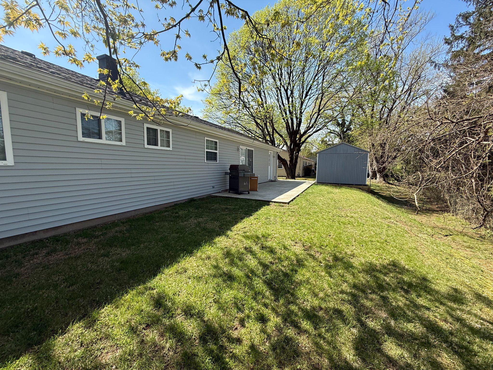1107 Cromwell Road Glenside, PA 19038 - Photo 18 of 28 Spacious backyard with serene greenery and patio.