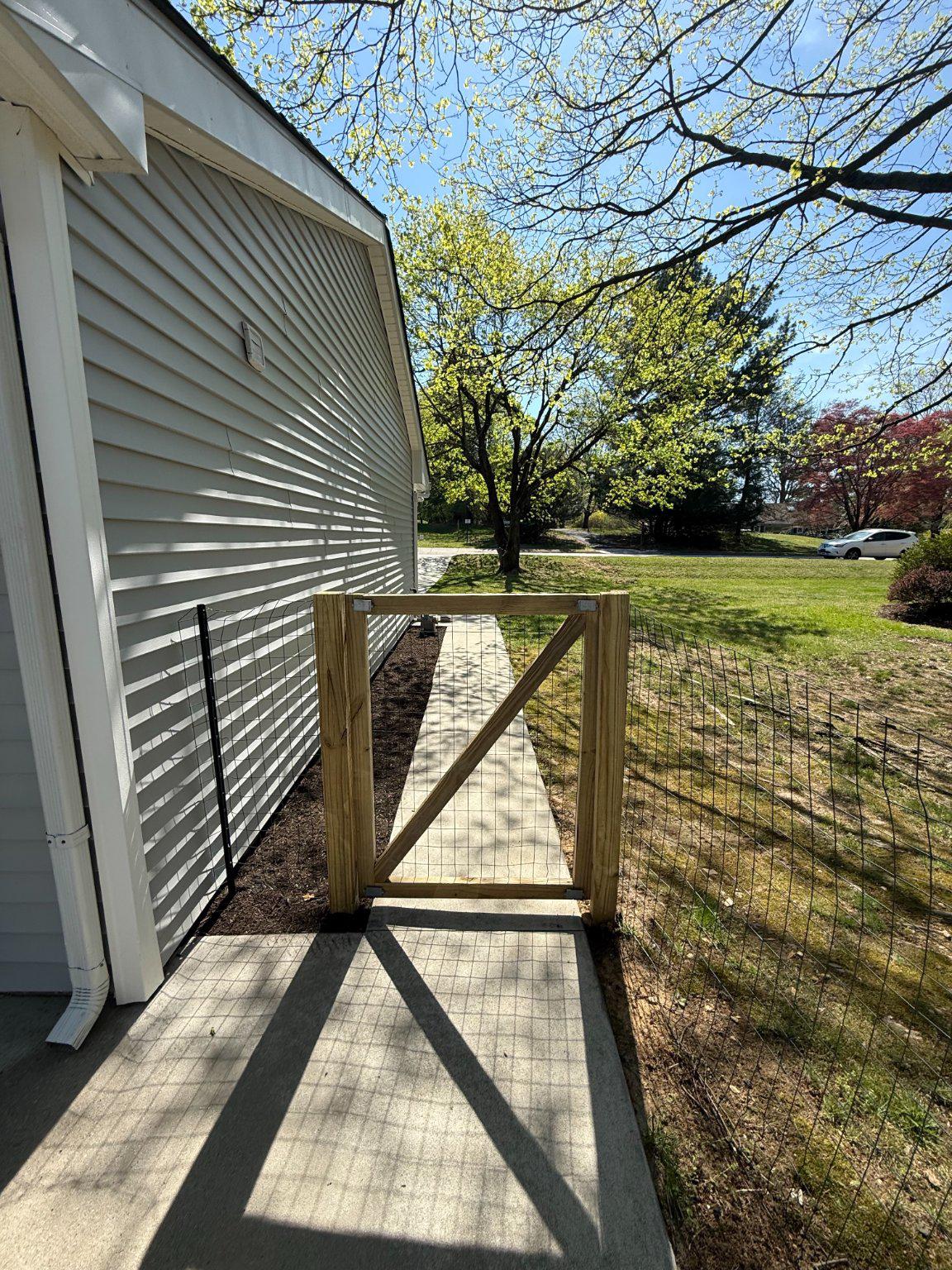 1107 Cromwell Road Glenside, PA 19038 - Photo 21 of 28 Charming pathway to serene backyard with fence.