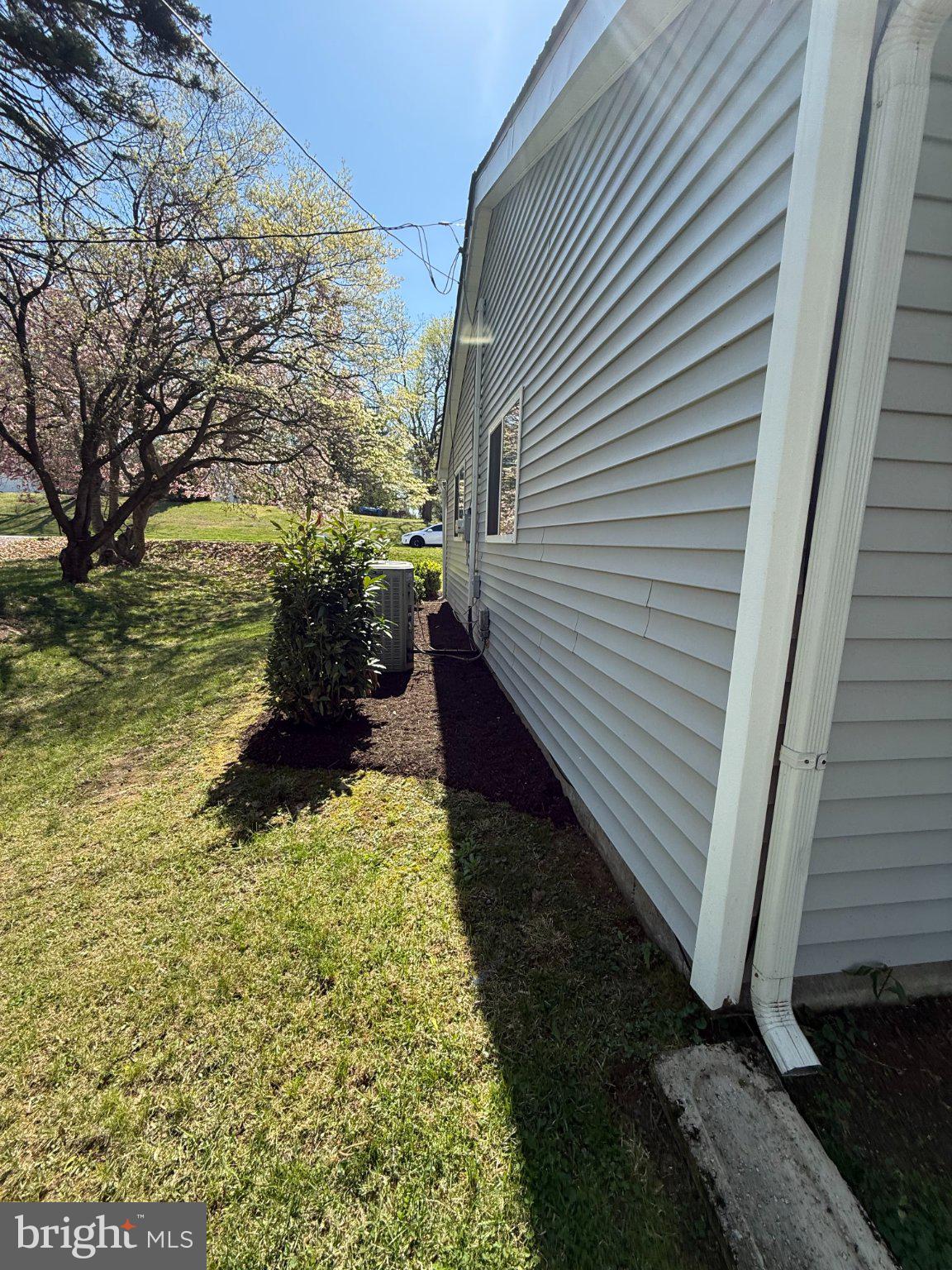 1107 Cromwell Road Glenside, PA 19038 - Photo 23 of 28 Sunlit side yard with lush greenery.