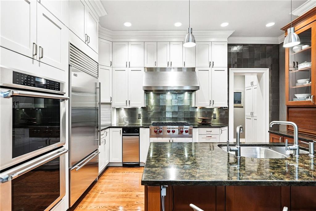 400 Devonshire Street Pittsburgh, PA 15213 - Photo 17 of 49 a kitchen with stainless steel appliances granite countertop a refrigerator a stove and a sink
