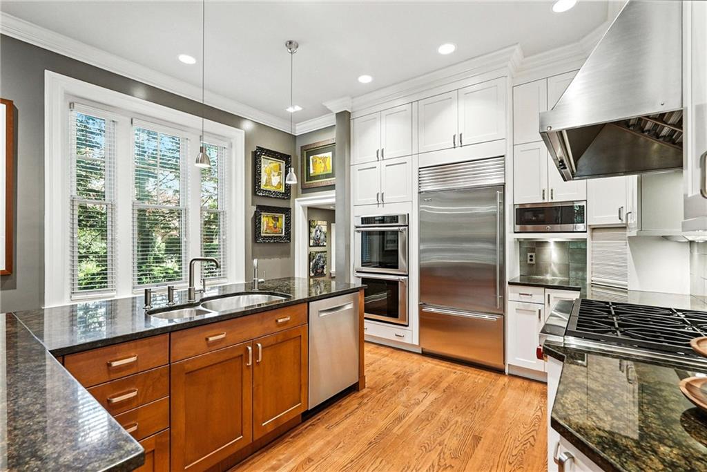 400 Devonshire Street Pittsburgh, PA 15213 - Photo 18 of 49 a kitchen with stainless steel appliances granite countertop a refrigerator a stove and a sink