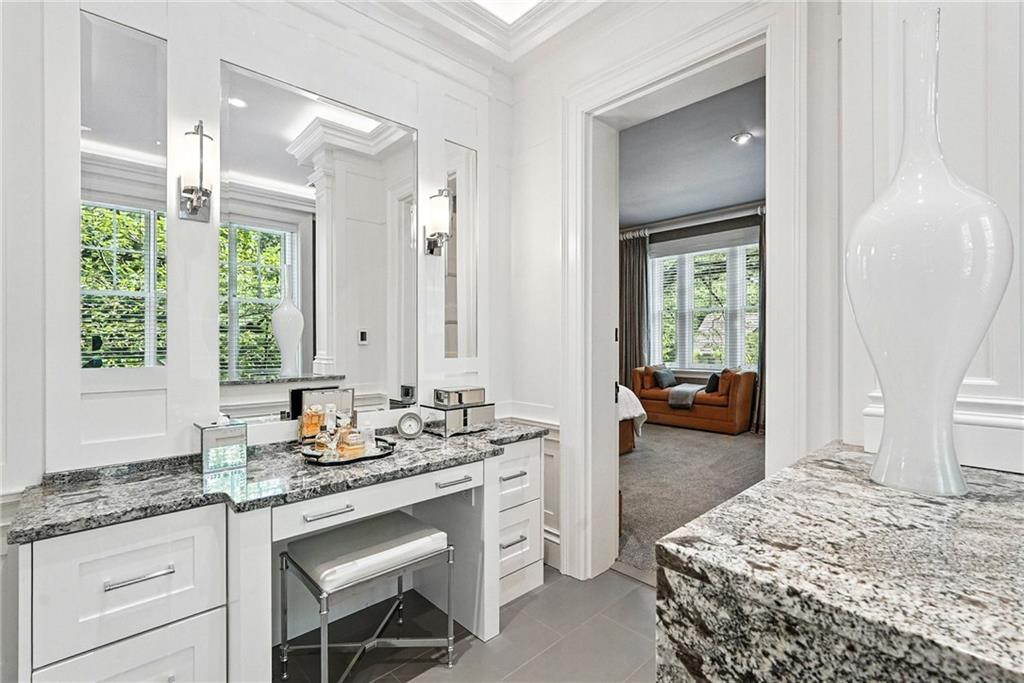 400 Devonshire Street Pittsburgh, PA 15213 - Photo 29 of 49 a spacious bathroom with a granite countertop sink and a mirror
