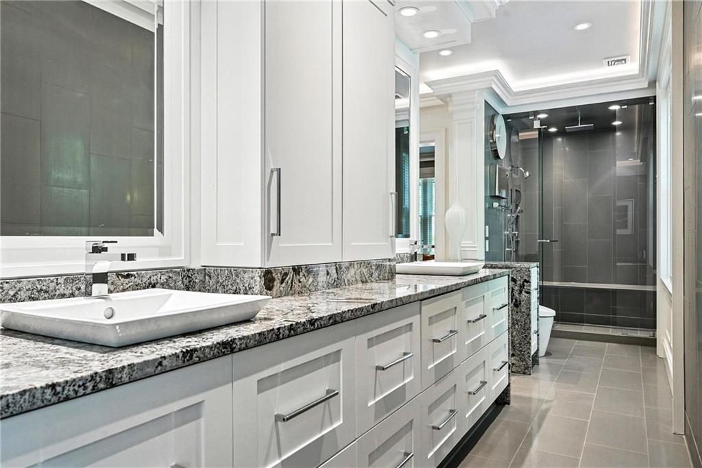 400 Devonshire Street Pittsburgh, PA 15213 - Photo 30 of 49 a bathroom with a granite countertop double vanity sink and mirror