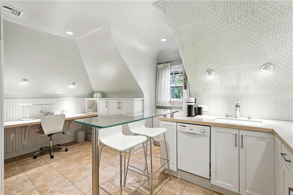 400 Devonshire Street Pittsburgh, PA 15213 - Photo 40 of 49 a kitchen with a sink and chairs