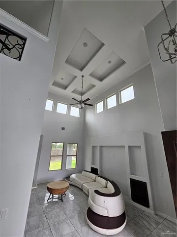 a living room with furniture a rug and a fireplace