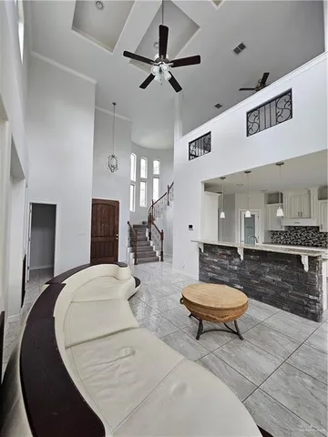 a kitchen with stainless steel appliances a stove top oven a sink a counter top space and cabinets