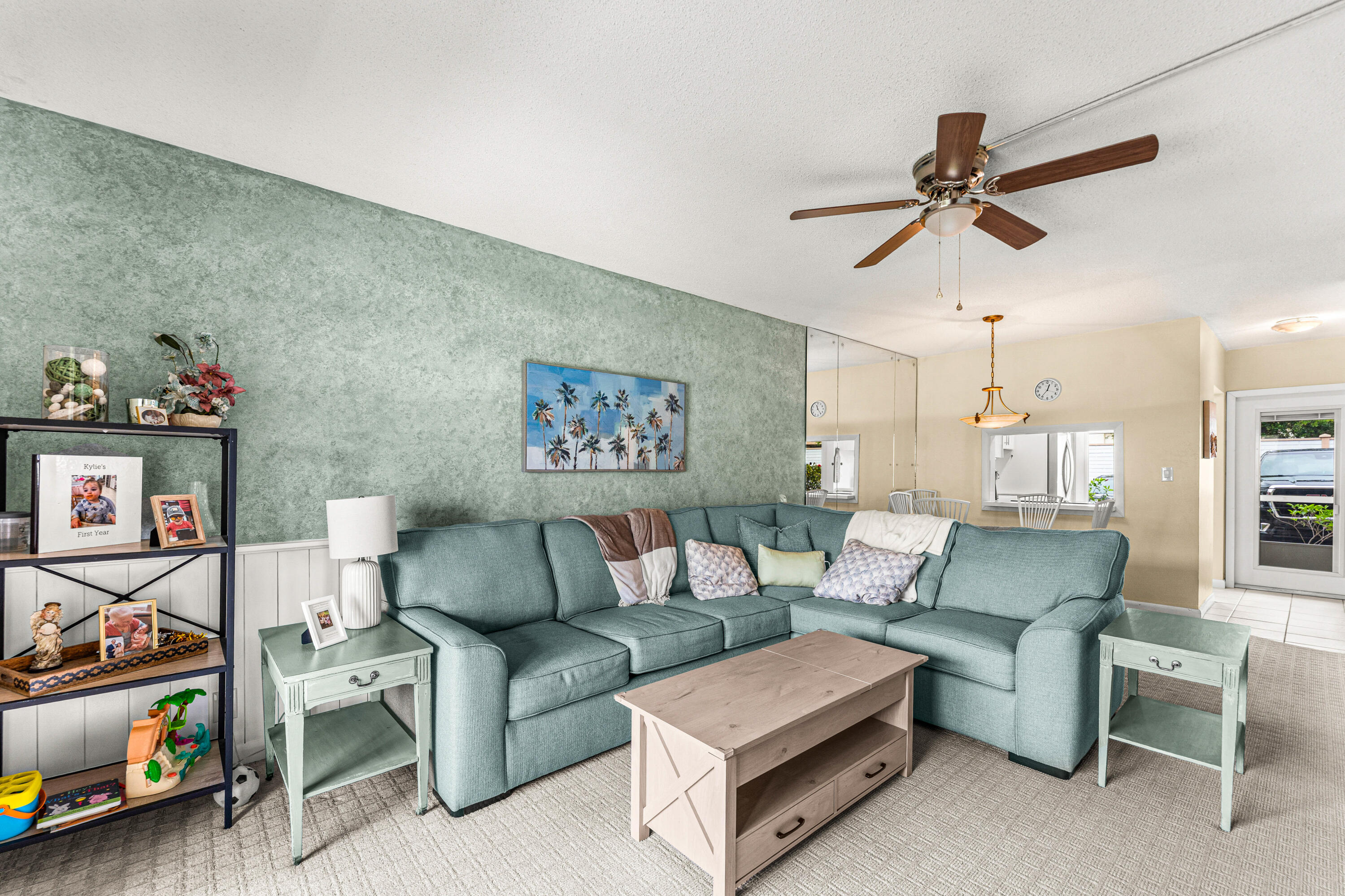 1951 Northeast 39th Street, Unit 131 Lighthouse Point, FL 33064 - Photo 21 of 31 a living room with furniture and a flat screen tv