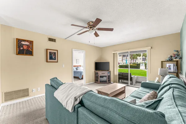 a view of living room with furniture and window