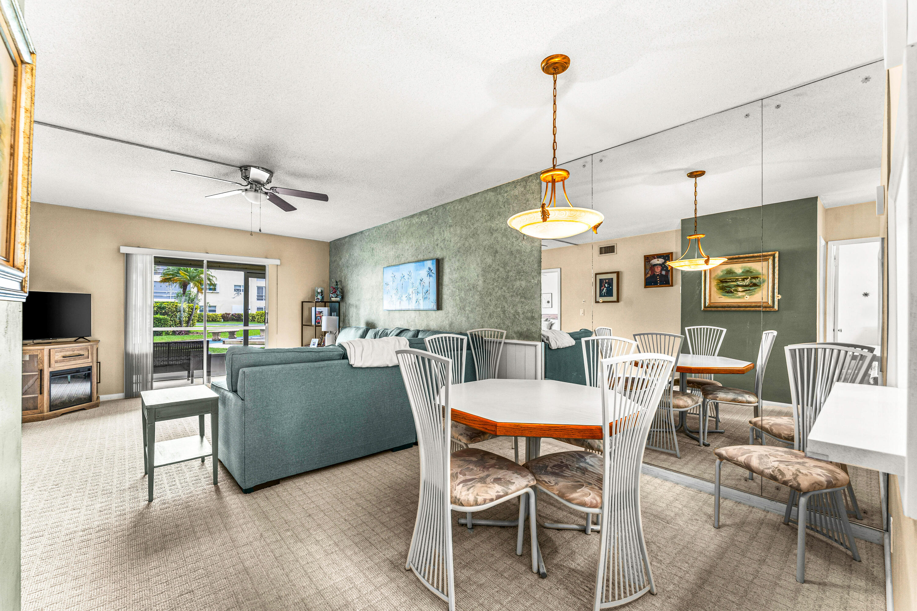 1951 Northeast 39th Street, Unit 131 Lighthouse Point, FL 33064 - Photo 25 of 31 a view of a dining room with furniture window and wooden floor