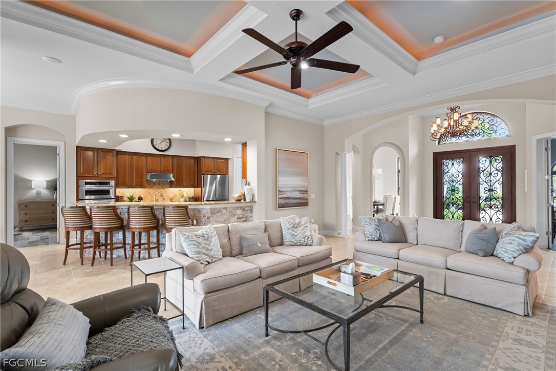 9383 Slate Court Naples, FL 34120 - Photo 8 of 28 a living room with furniture and a large window
