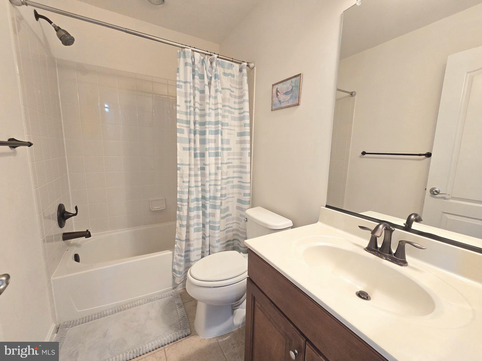 23012 Meadow Mist Road Clarksburg, MD 20871 - Photo 11 of 19 a bathroom with a sink toilet and shower