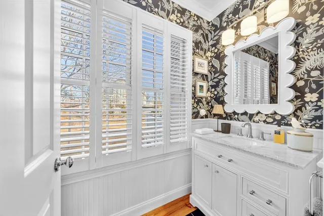 a bathroom with a sink and a window