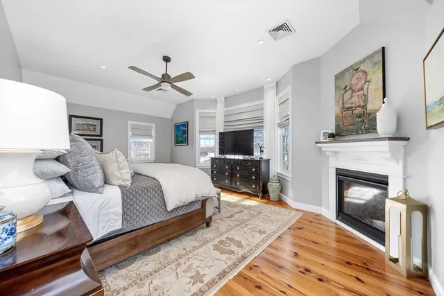 a bed room with a bed and a fireplace