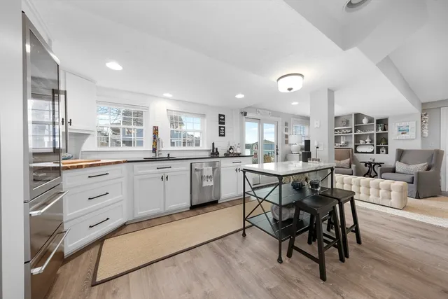 a living room with furniture and a large mirror