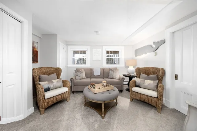 a view of a patio with couches and table and chairs and potted plants