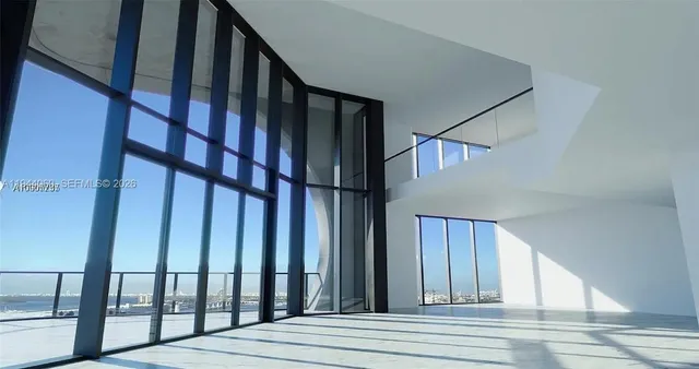 a view of staircase with railing and stairs