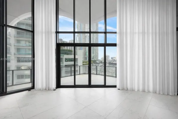 a view of an empty room with windows