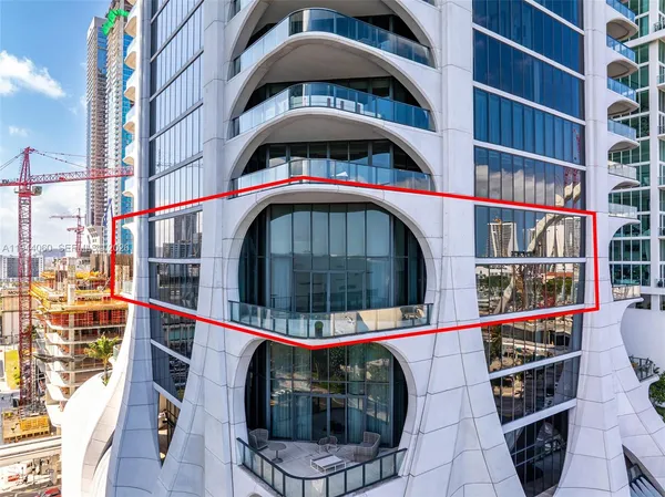 a view of an empty room with windows