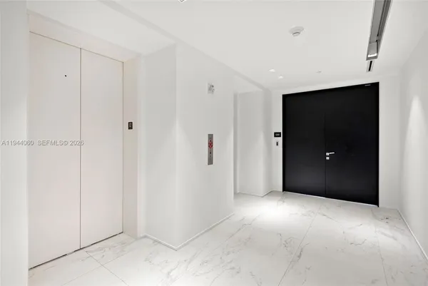 a view of an empty room with windows