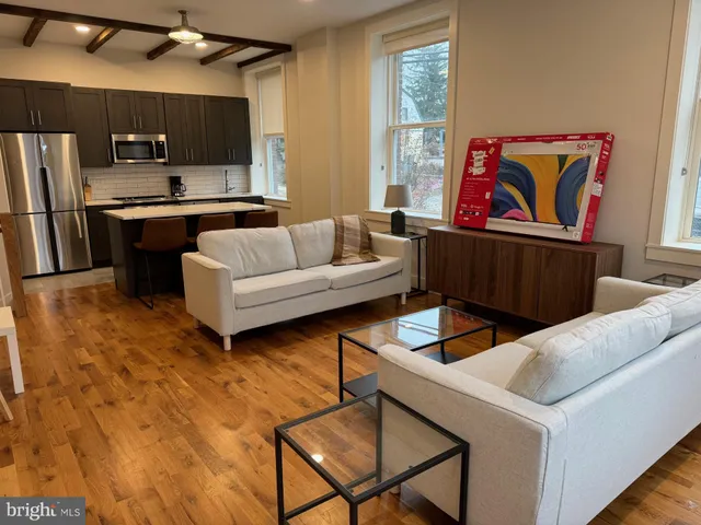 a living room with furniture and a window