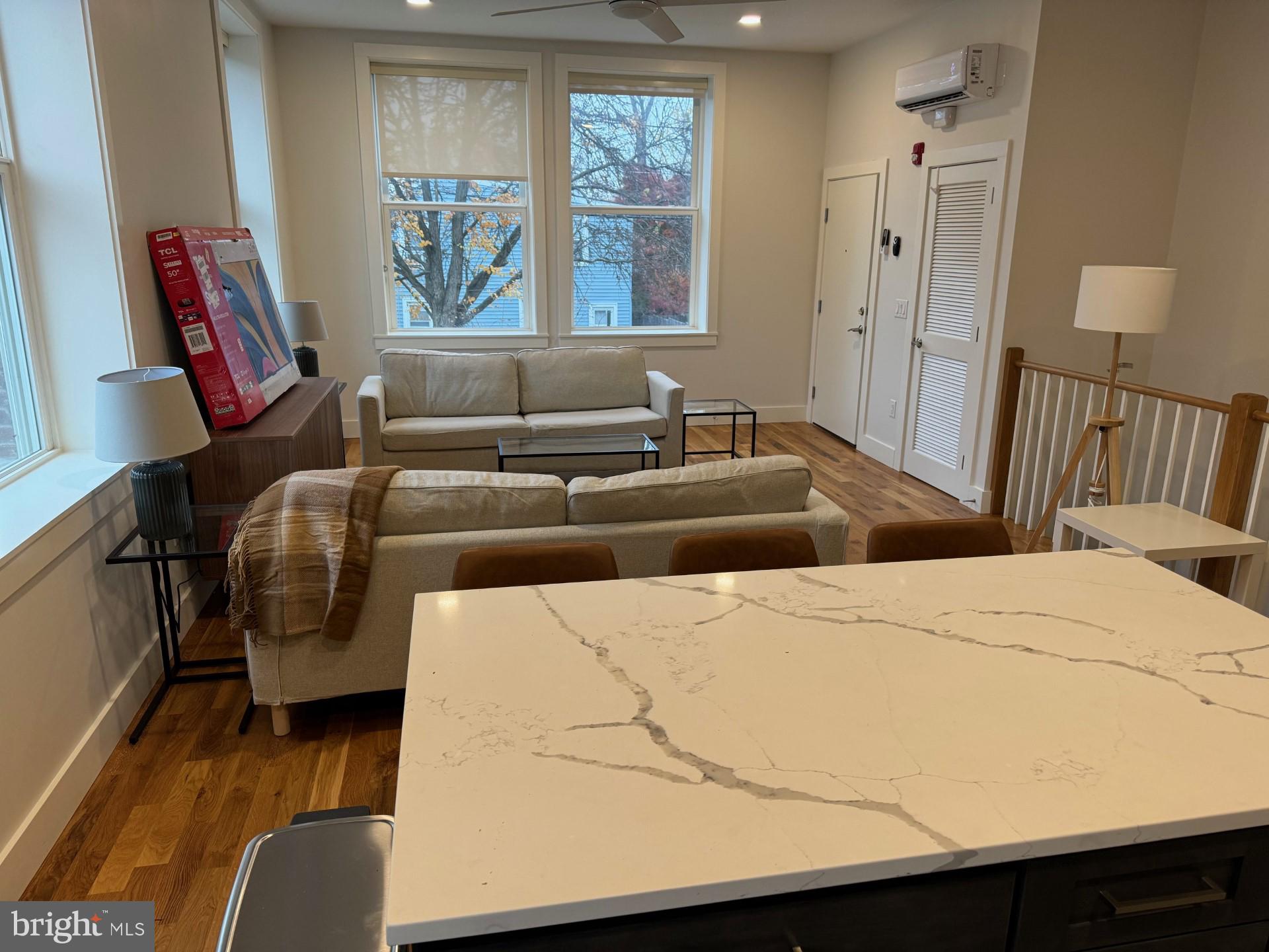 30 MacLean Street, Unit 3 Princeton, NJ 08542 - Photo 3 of 8 a bedroom with a bed and wooden floor